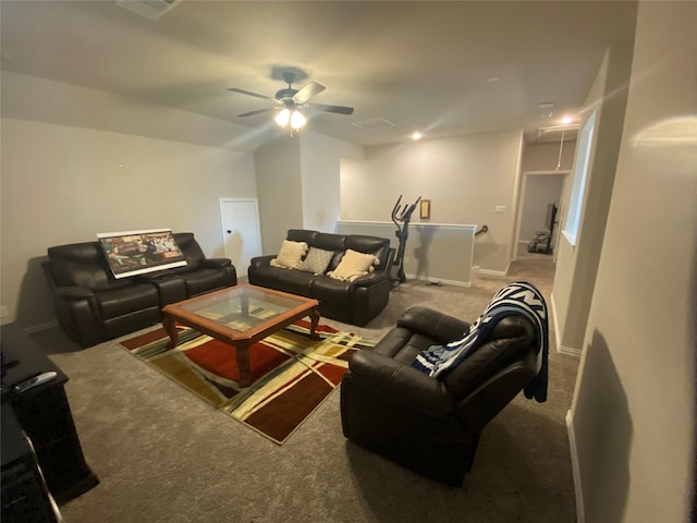 carpeted living room with ceiling fan and lofted ceiling