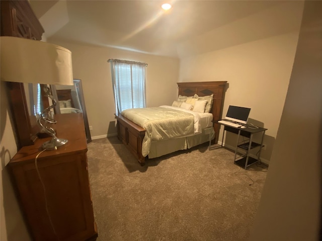 bedroom with dark colored carpet