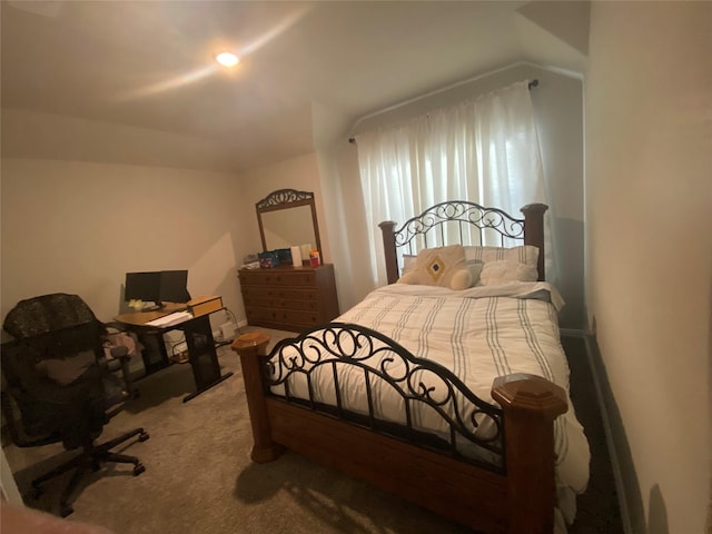 bedroom featuring carpet floors and lofted ceiling