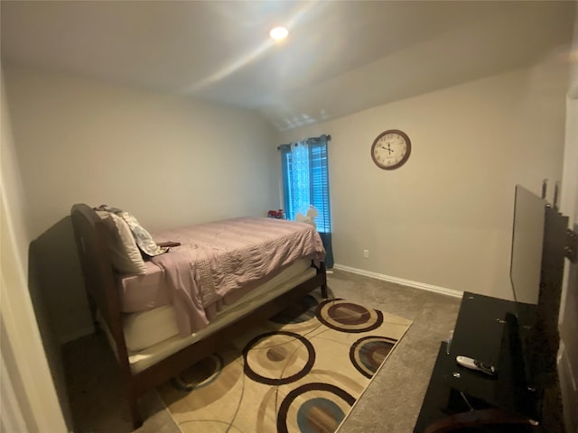 carpeted bedroom featuring lofted ceiling