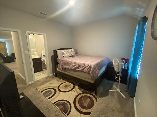 carpeted bedroom with ensuite bathroom