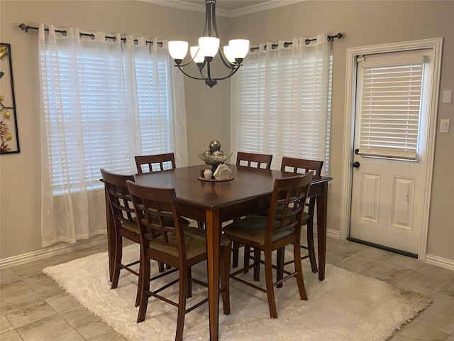 dining space with a chandelier and ornamental molding