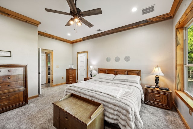 carpeted bedroom with crown molding and ceiling fan