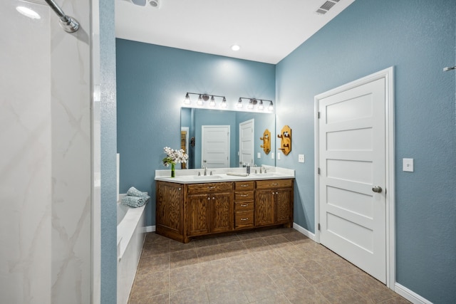 bathroom with vanity and a washtub