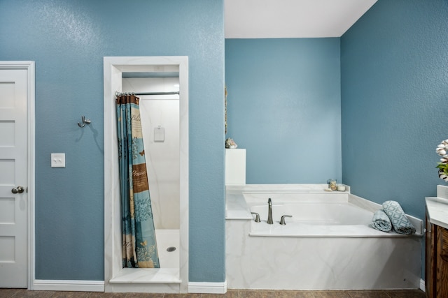 bathroom with shower with separate bathtub and vanity