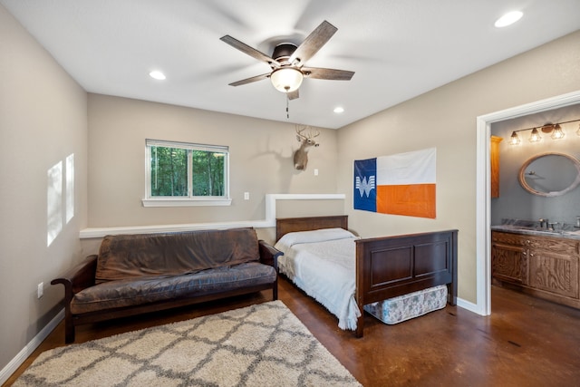 bedroom featuring ceiling fan, connected bathroom, and sink