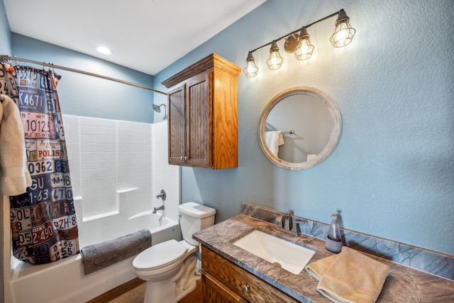 full bathroom featuring vanity, shower / tub combo, and toilet