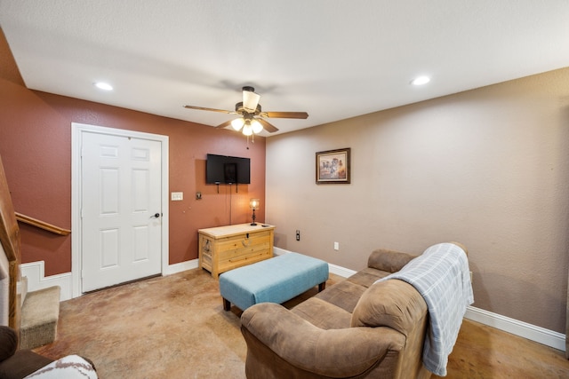 carpeted living room featuring ceiling fan