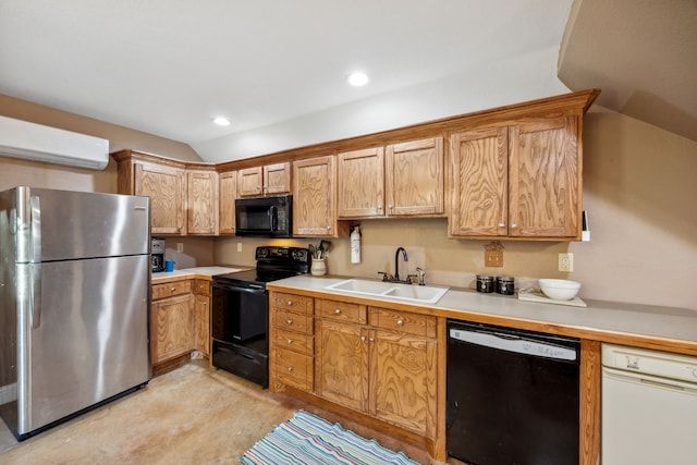 kitchen featuring lofted ceiling, black appliances, a wall unit AC, and sink