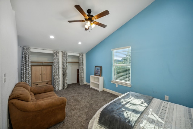 bedroom with ceiling fan, dark colored carpet, and high vaulted ceiling