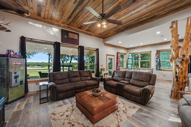 living room with crown molding, wood ceiling, ceiling fan, and hardwood / wood-style flooring