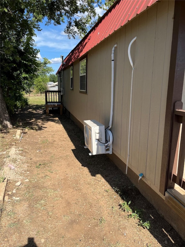 view of side of property featuring ac unit