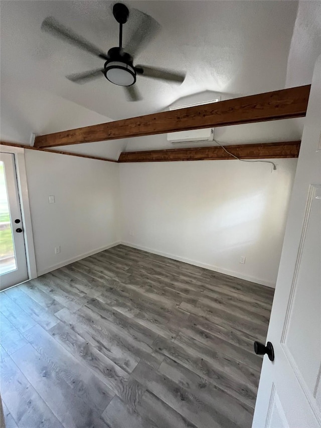 interior space featuring a textured ceiling, vaulted ceiling with beams, hardwood / wood-style flooring, and ceiling fan