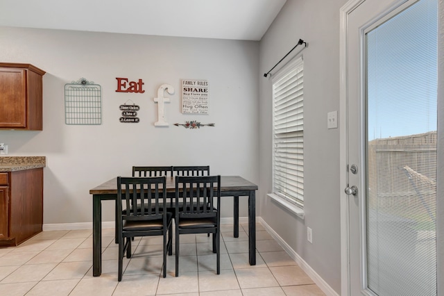 tiled dining area featuring a wealth of natural light