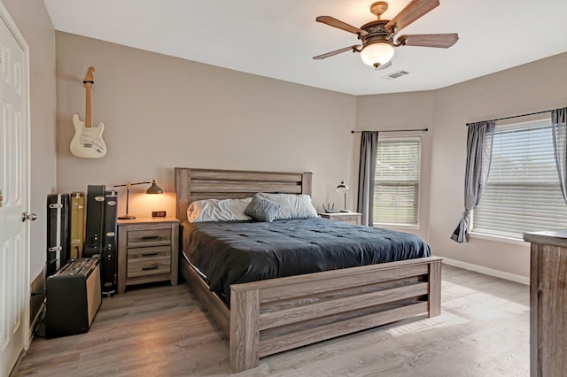 bedroom featuring ceiling fan and light hardwood / wood-style flooring