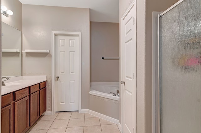 bathroom featuring vanity, tile patterned floors, and separate shower and tub