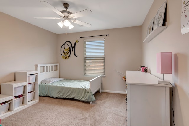 bedroom featuring light carpet and ceiling fan