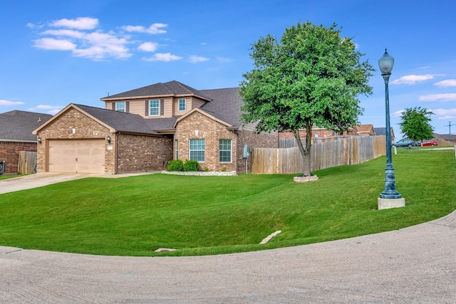 view of front facade with a front yard and a garage