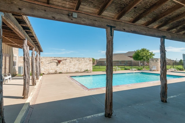 view of swimming pool featuring a patio area