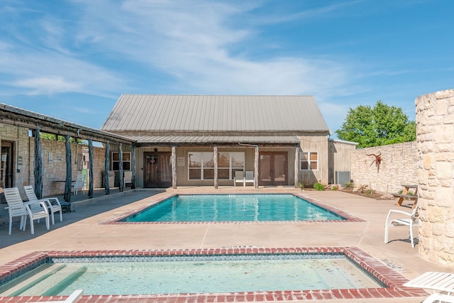 view of pool featuring a patio