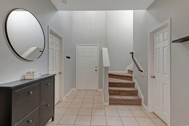 entrance foyer featuring light tile patterned floors