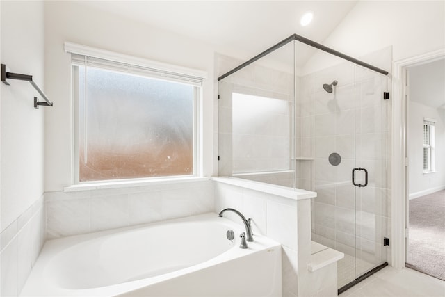 bathroom featuring separate shower and tub and lofted ceiling