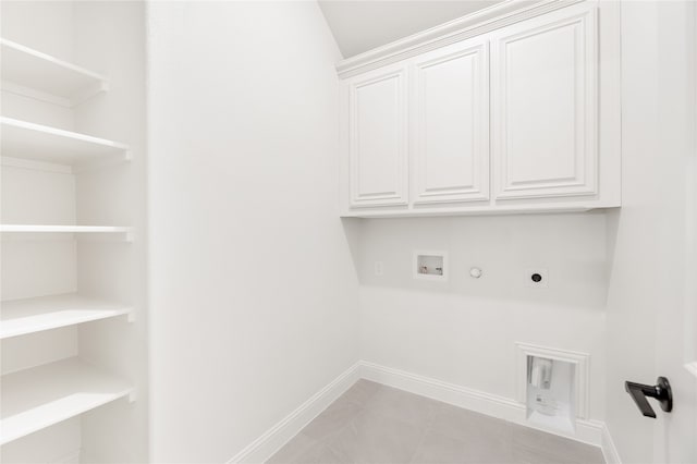 clothes washing area with light tile patterned floors, hookup for an electric dryer, hookup for a gas dryer, cabinets, and hookup for a washing machine