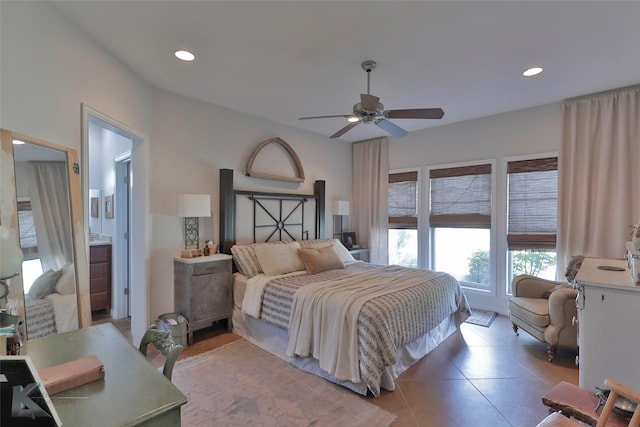 tiled bedroom with ceiling fan and ensuite bathroom