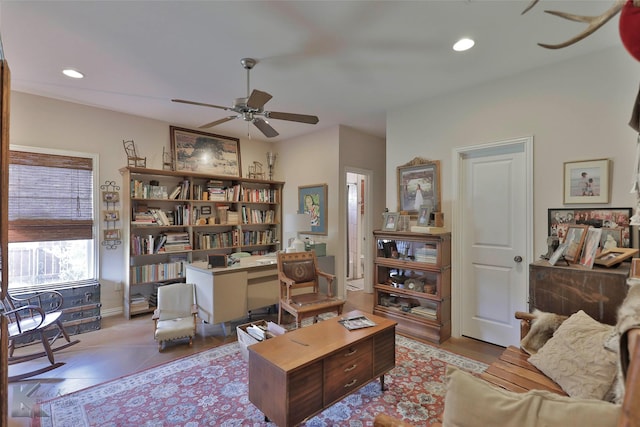 tiled living room with ceiling fan