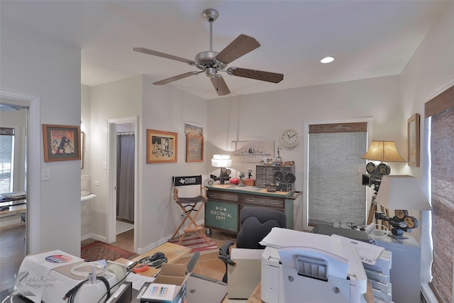 interior space with ceiling fan and tile patterned flooring