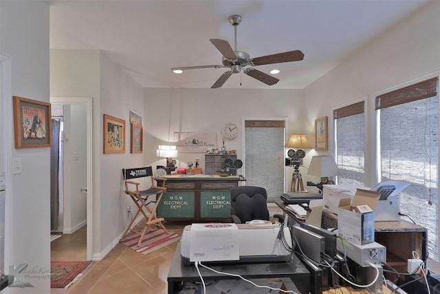 home office with ceiling fan and light tile patterned floors