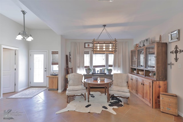 tiled dining area with a wealth of natural light and a chandelier