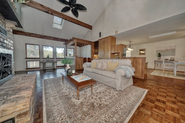 living room with a skylight, dark parquet floors, ceiling fan, beam ceiling, and high vaulted ceiling