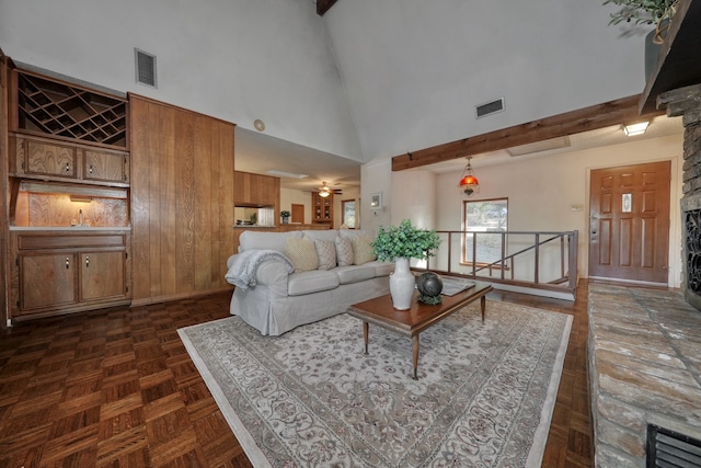 living room featuring ceiling fan, high vaulted ceiling, and dark parquet flooring