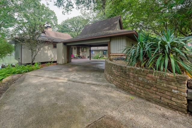 view of side of property featuring a carport