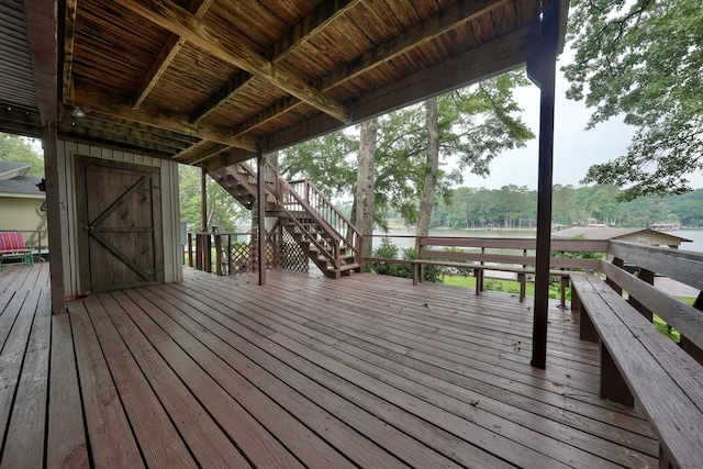 wooden deck with a water view