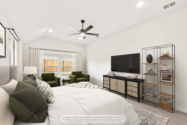 carpeted bedroom featuring lofted ceiling and ceiling fan