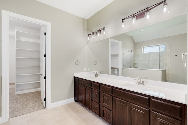 bathroom with tile patterned flooring and double sink vanity