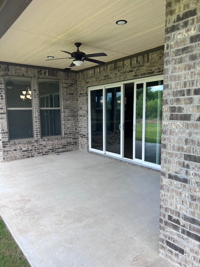 view of patio featuring ceiling fan