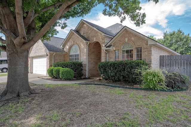 single story home featuring a garage