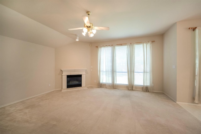 unfurnished living room with ceiling fan, light carpet, and lofted ceiling