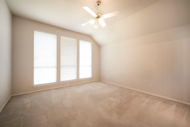 additional living space featuring ceiling fan, light colored carpet, and lofted ceiling