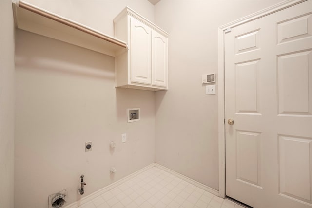 clothes washing area featuring electric dryer hookup, hookup for a gas dryer, cabinets, and washer hookup