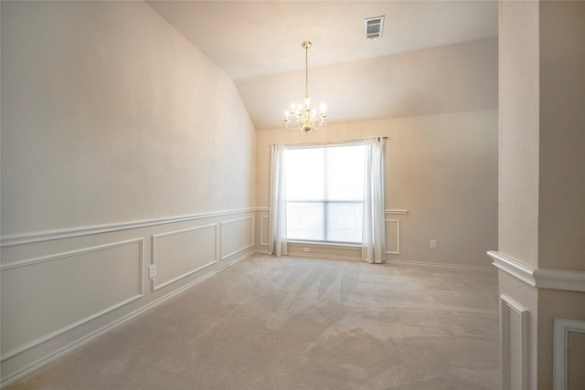 unfurnished room with light carpet, vaulted ceiling, and a notable chandelier