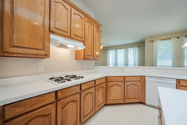 kitchen featuring sink and white appliances