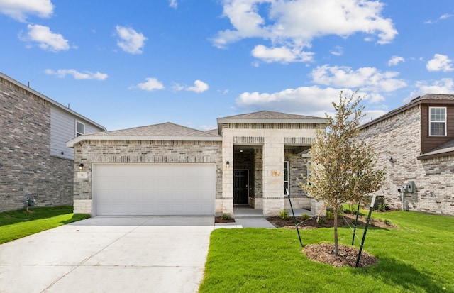 view of front of property with a front lawn and a garage