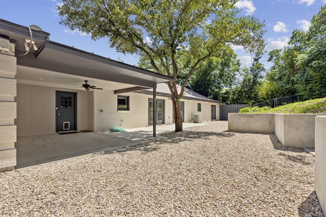 exterior space with ceiling fan, a patio area, and central AC unit