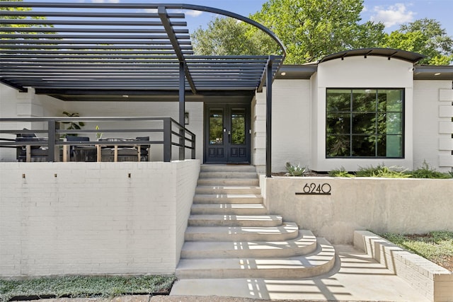 entrance to property featuring french doors