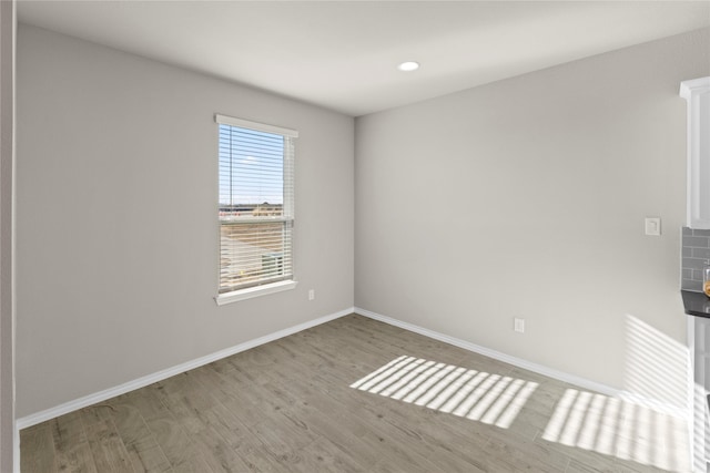 spare room with light hardwood / wood-style floors