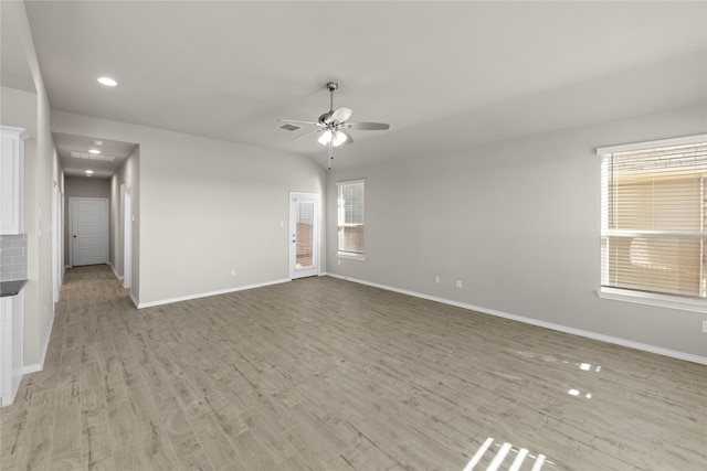 empty room featuring ceiling fan and light hardwood / wood-style floors